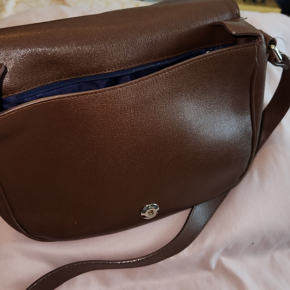 Furla crossbody bag. Still has a lot of life . Very strong and beautiful.